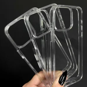 a hand holding a group of clear plastic cases